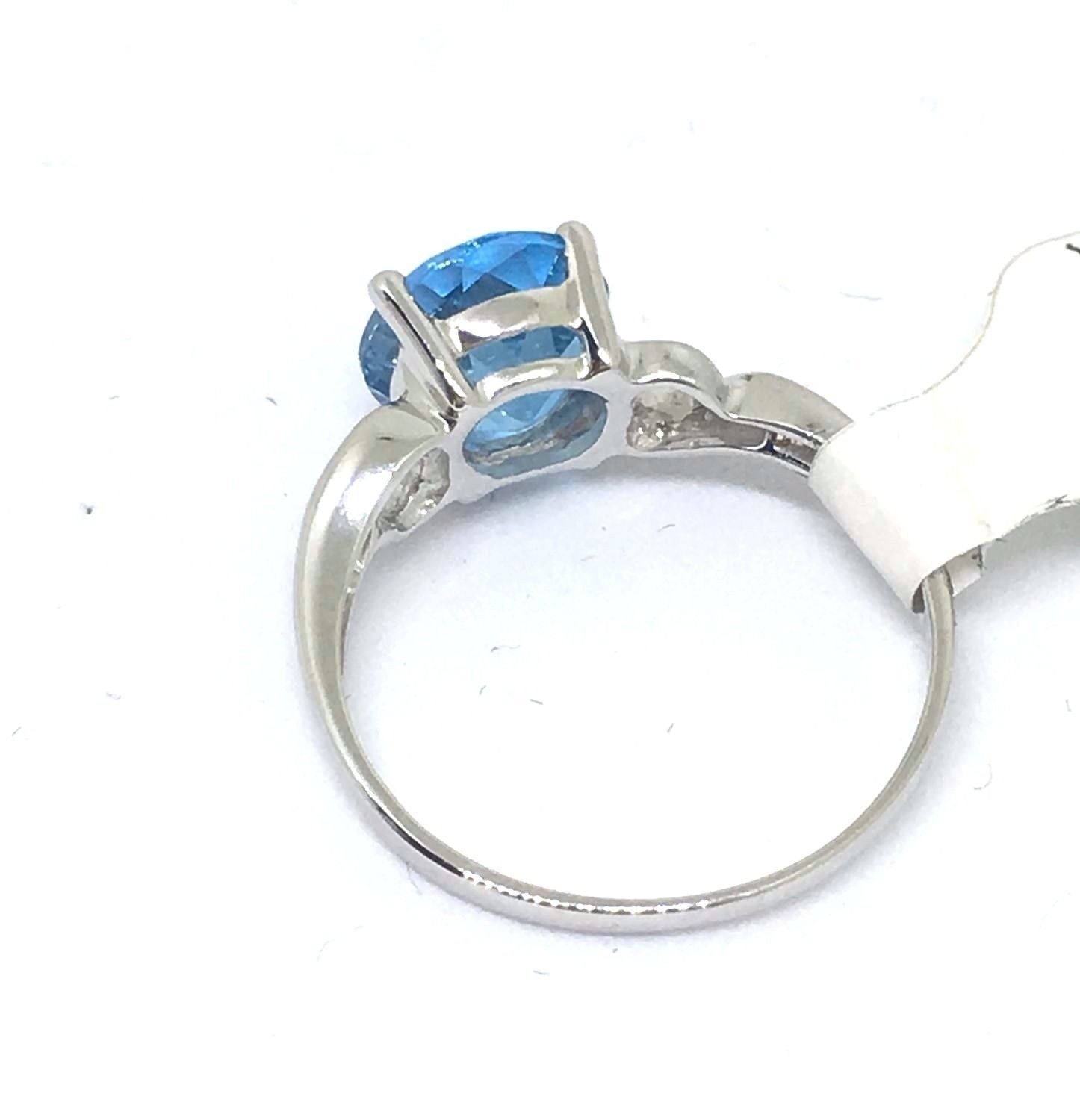 14K white gold and Genuine 2.35K Blue Topaz Ring, 2.3 grams $850 NWT Size 6 1/2